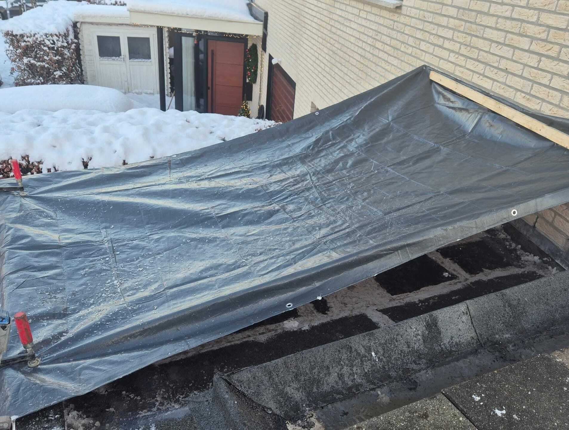 Noodreparatie bij een lekkend plat dak