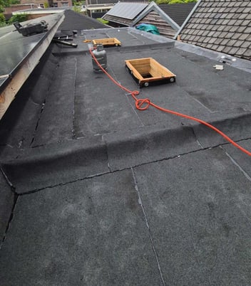 Plat dak inspecteren